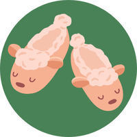 green circle with cartoon image of sheep slippers inside it