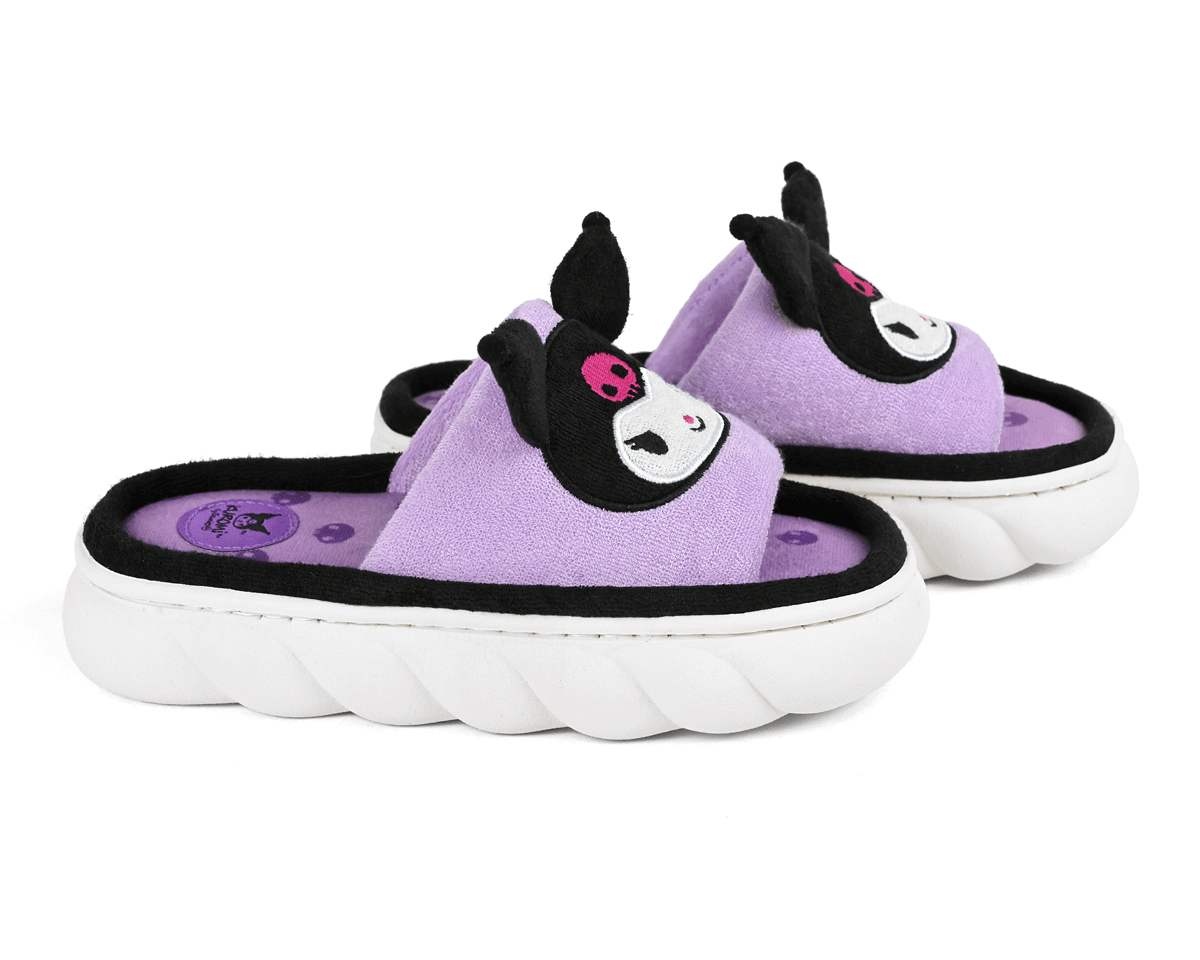 Pair of purple slippers with face of the Sanrio character Kuromi, seen from the side to show the cloud-textured soles.