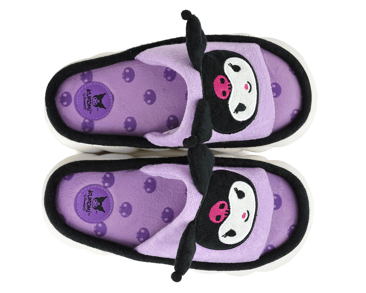 Pair of purple slippers with face of the Sanrio character Kuromi, seen from above to show the purple, skull-patterned fabric footbeds and official Kuromi logo.