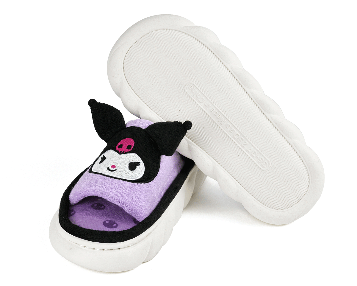 Pair of purple slippers with face of the Sanrio character Kuromi, one slipper is turned upside down to show the molded non-slip soles.