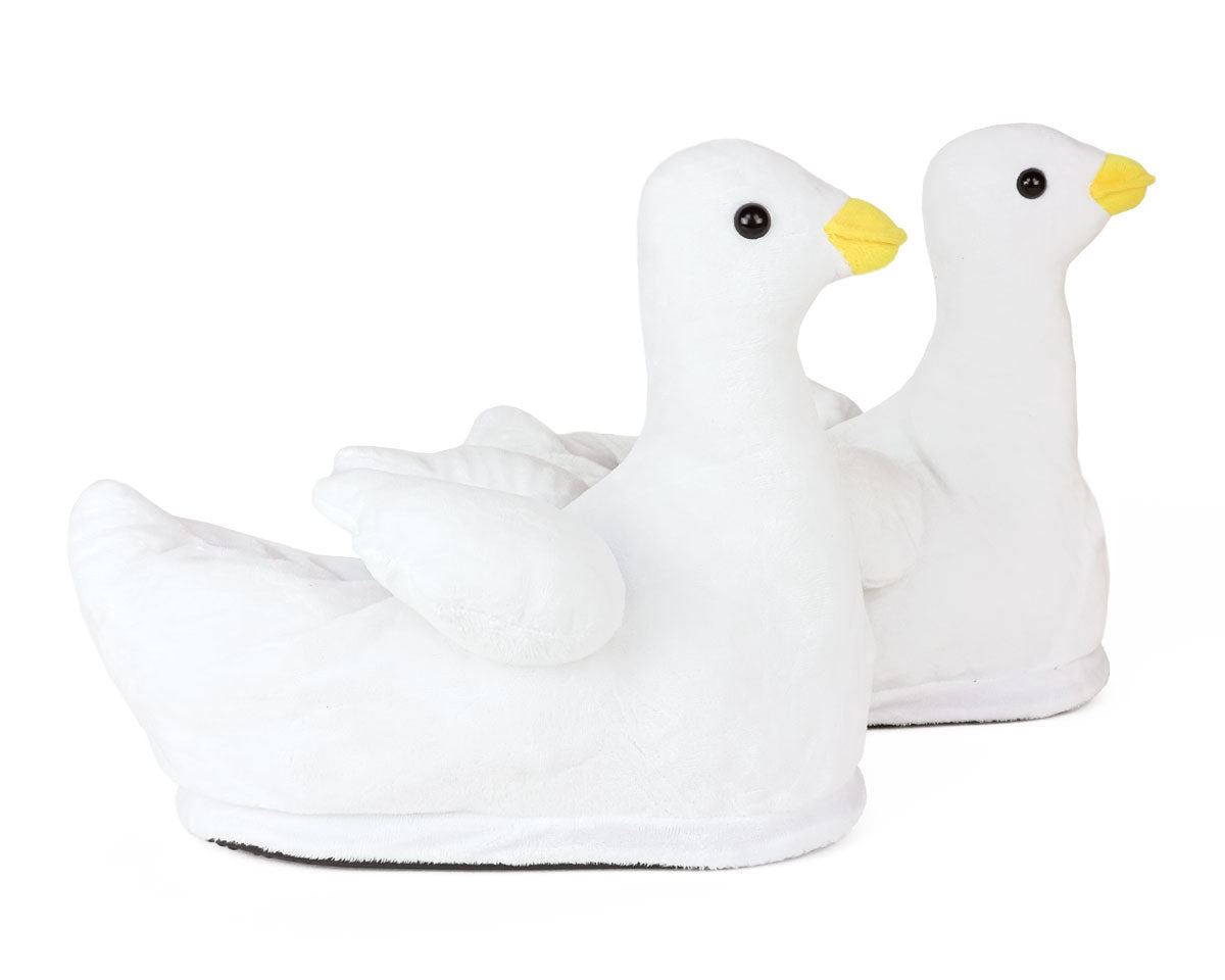 Two white goose-shaped slippers with yellow beaks on a white background
