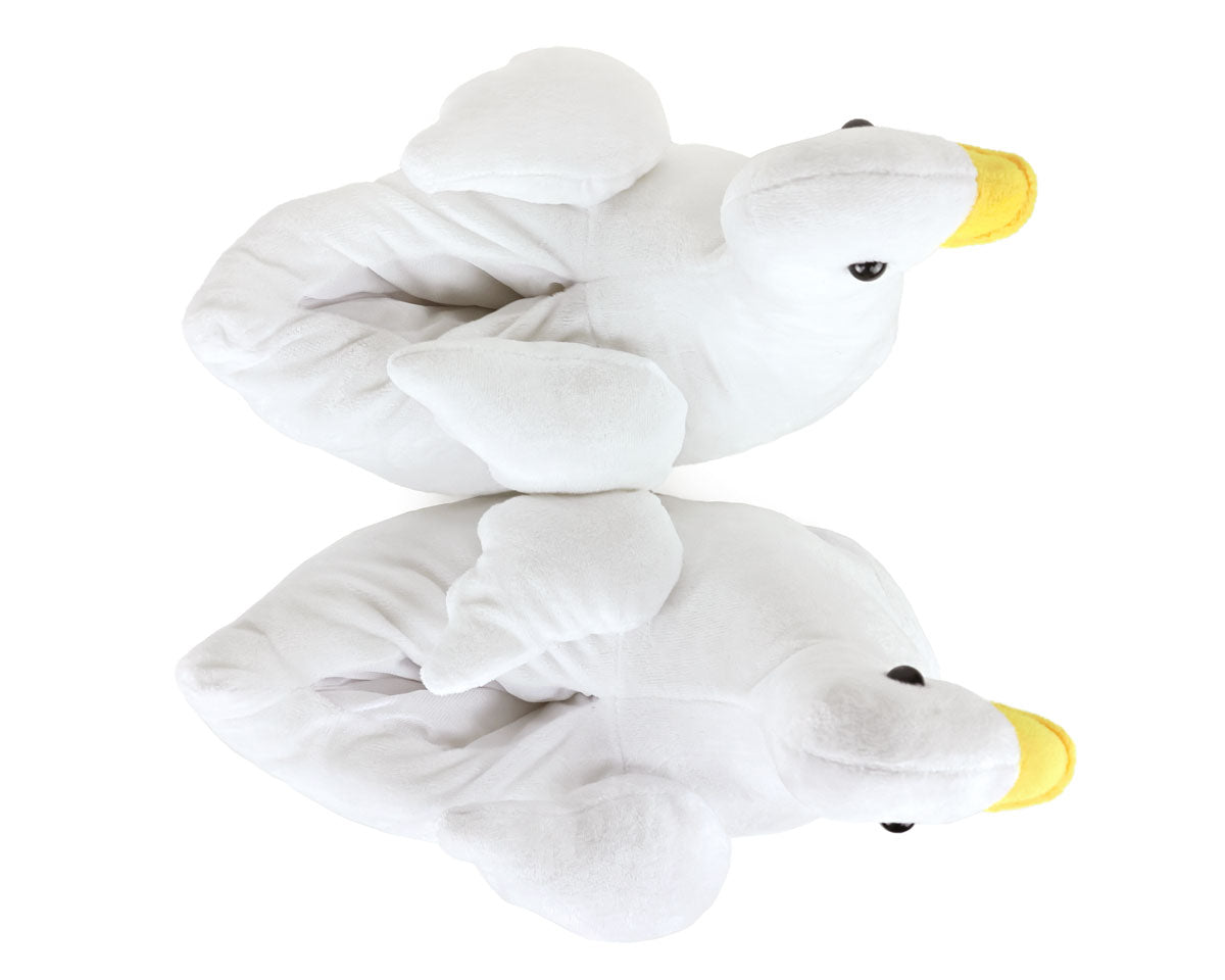 Two white plush goose slippers seen from above