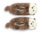 A pair of plush otter-shaped slippers in brown and cream white, shown from a top-down view on a plain white background.