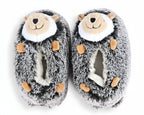 A pair of plush hedgehog slippers in gray and white faux fur with tan accents on the face and paws, shown on a plain white background.