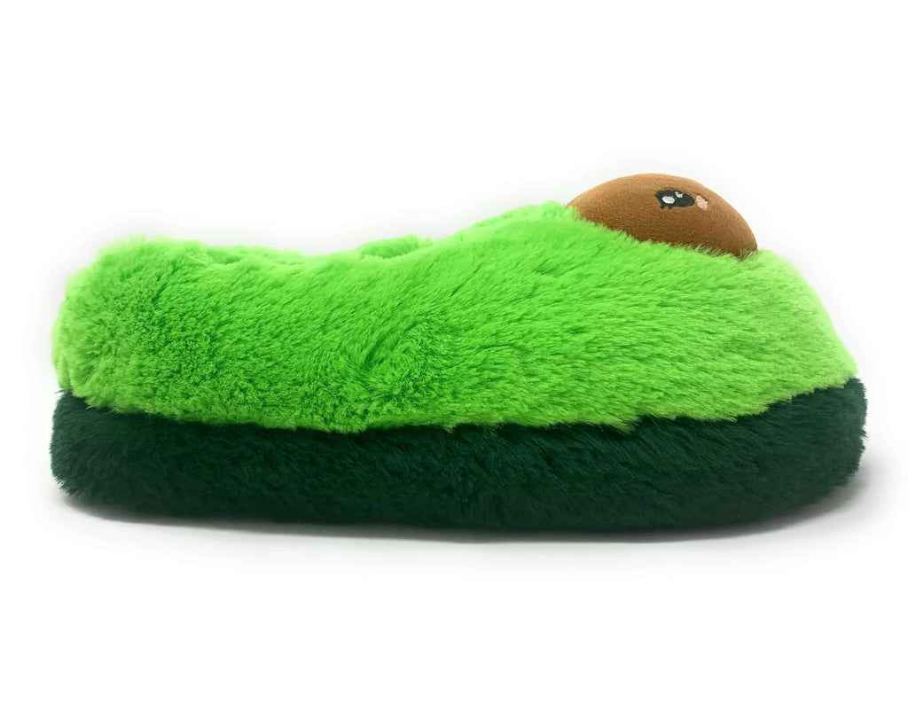 Green plush avocado slippers, seen from the side, on a white background