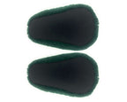 Pair of plush avocado slippers seen from the bottom, showing black fabric soles with non-slip grips, on a white background