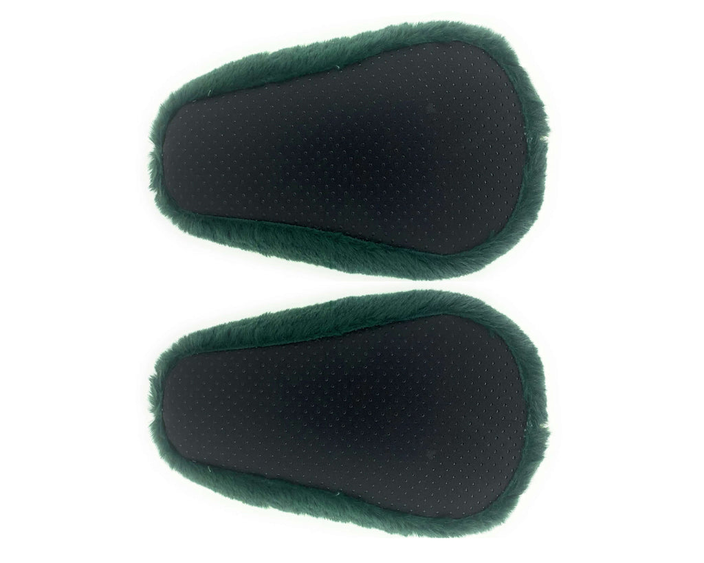 Pair of plush avocado slippers seen from the bottom, showing fabric footbeds with non-slip grips