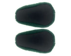 Pair of plush avocado slippers seen from the bottom, showing fabric footbeds with non-slip grips