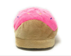 Plush donut slipper with pink glaze and brown bottom on a white background