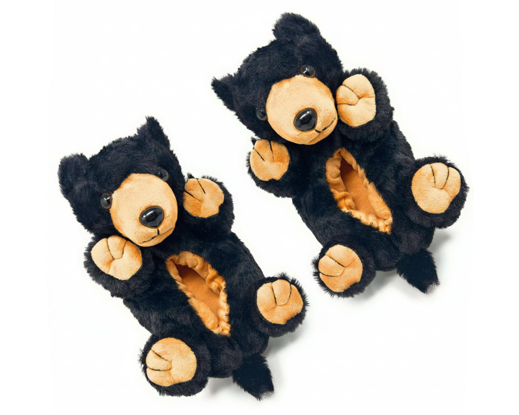 Pair of black and tan bear-shaped slippers on a white background