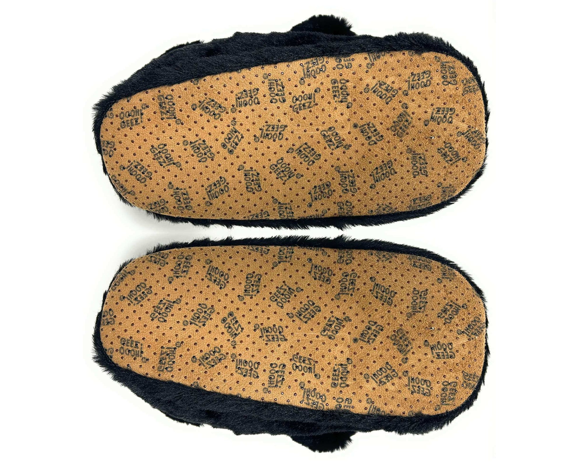 Pair of black bear slippers shown upside-down so that soles and non-slip grips are visible on a white background