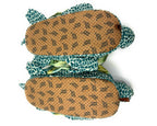 Bottom view of pair of plush Sea Turtle slippers, showing faux suede soles with non-slip grips