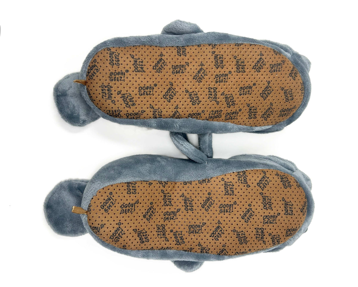 Pair of gray animal slippers turned upside-down to show brown soles on a white background