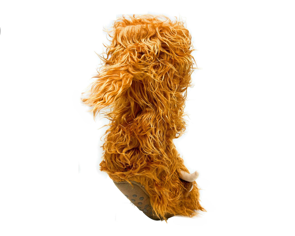 Plush highland cattle sock with orange fuzzy fur and non-slip grips on sole, on a white background