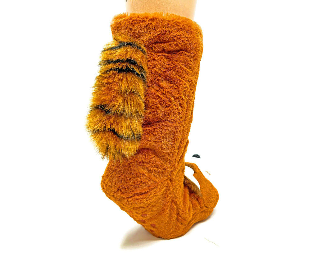 Orange fuzzy socks seen from the back with a fuzzy striped tail on a white background