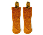 A pair of plush slipper boots in a warm rust-orange color, featuring textured grip dots on the soles and fuzzy animal-print tails. 