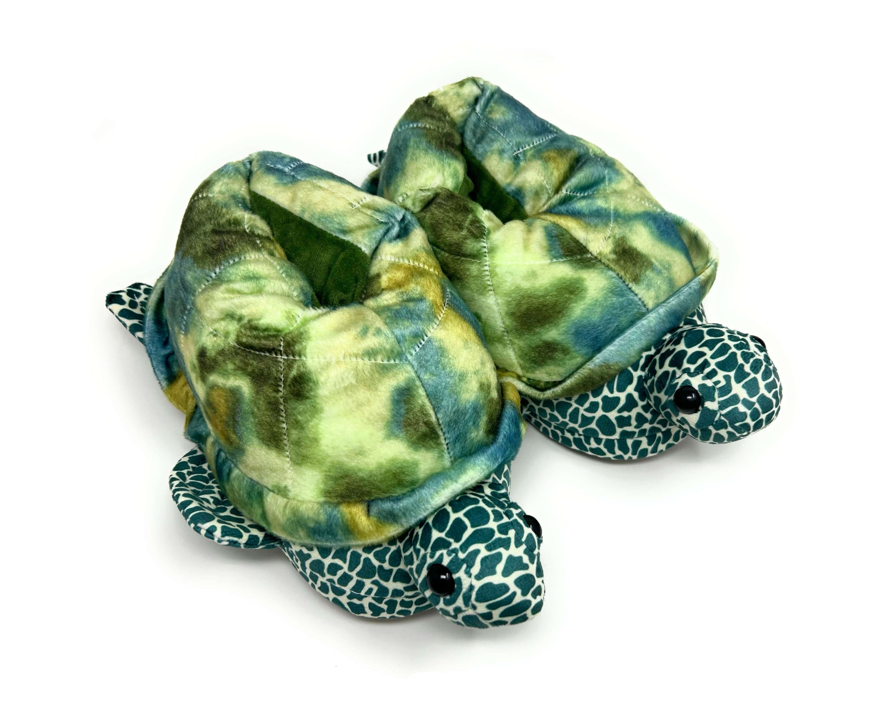 Turtle-shaped slippers with green and blue pattern on a white background