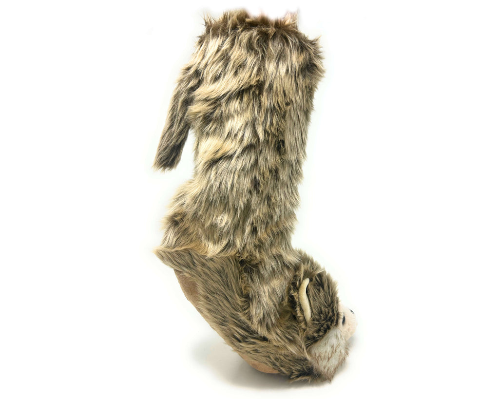 A wolf sock slipper with a wolf head on its toe, brown and gray faux fur, and a tail on the back. 