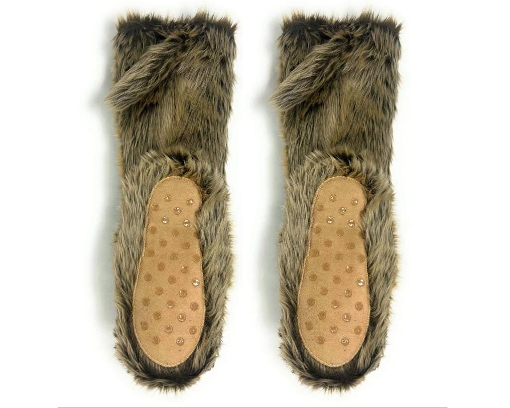 A pair of furry slipper booties with brown and gray faux fur and tan suede soles with non-slip grips, shown against a plain white background.