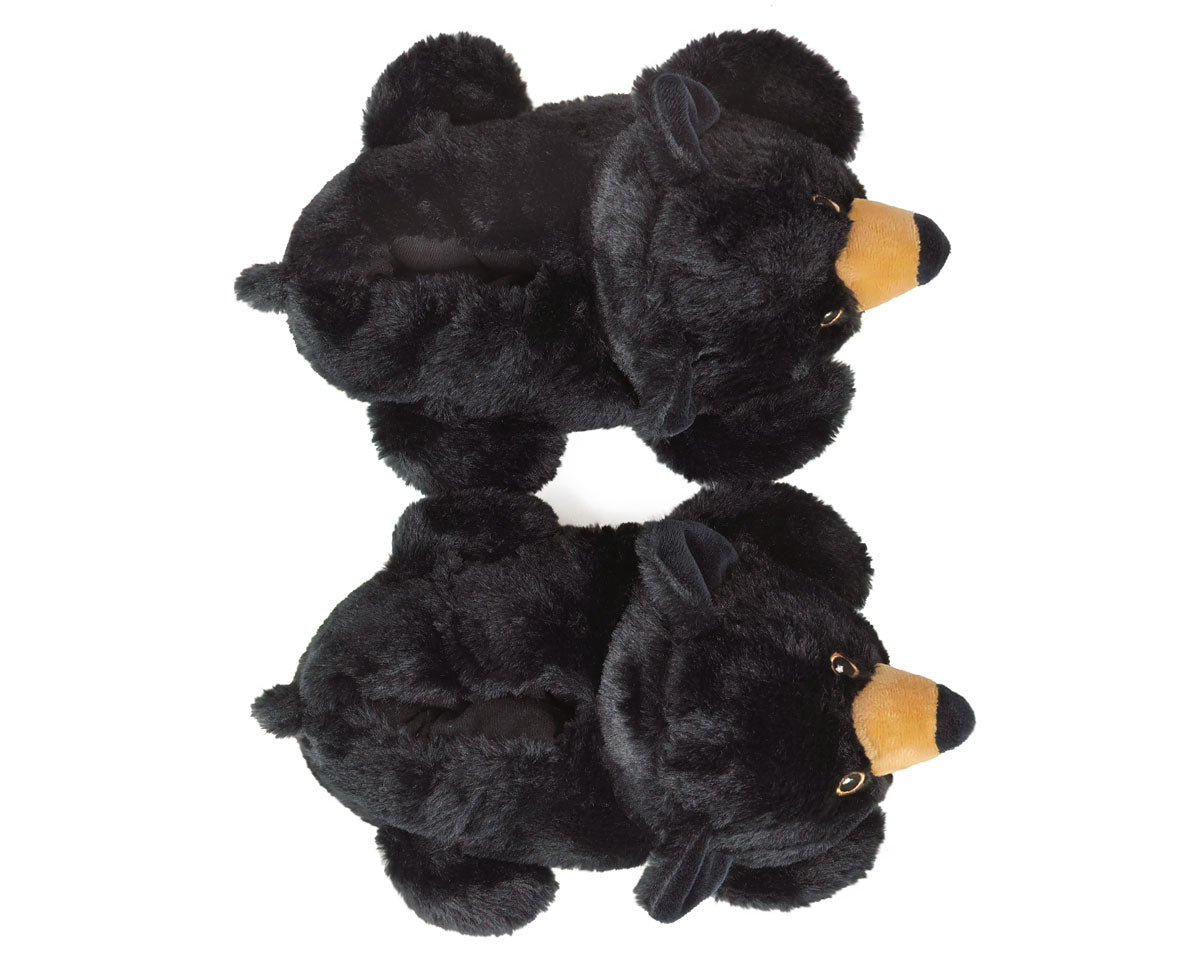 Two black plush bears slippers with brown noses on a white background, seen from above