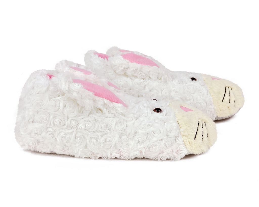 White bunny slippers with pink accents on a white background, seen from the side