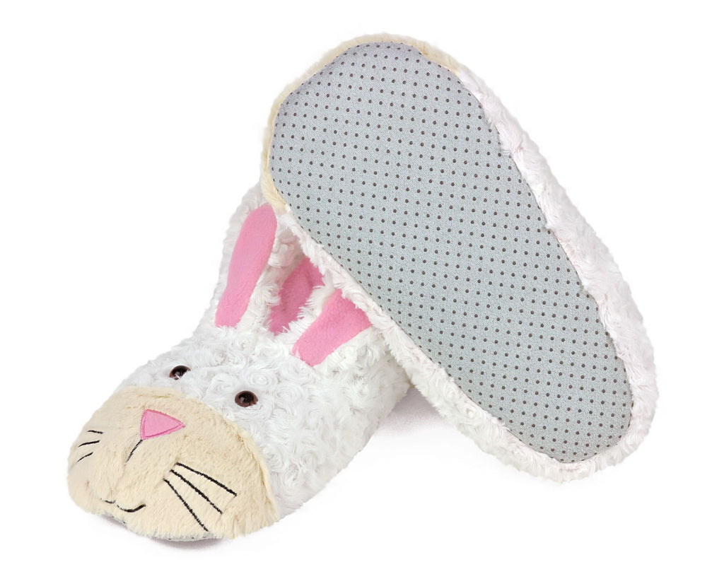Pair of bunny slippers on a white background, one slipper is turned upside down to show faux suede sole with non-slip grips