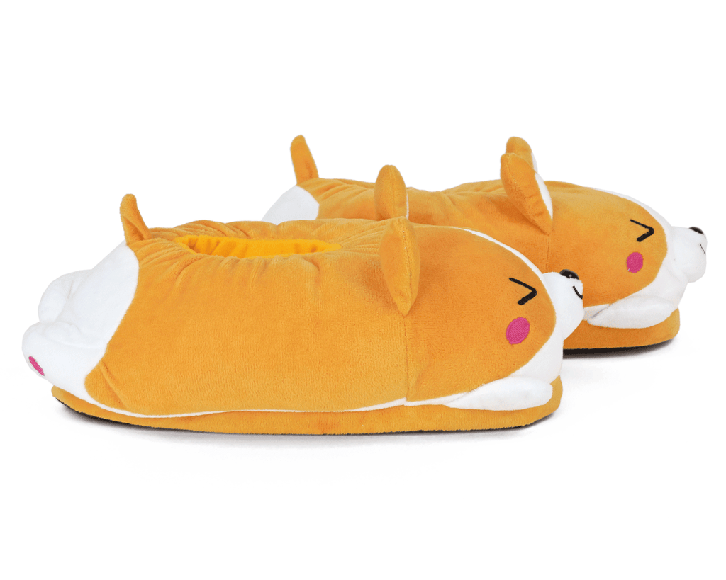 Pair of cartoonish dog-shaped slippers on a white background