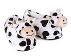 Pair of plush Holstein Cow Slippers on a white background