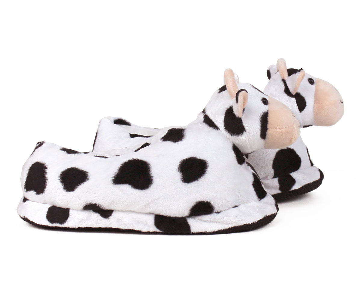 Pair of Cow-patterned slippers on a white background