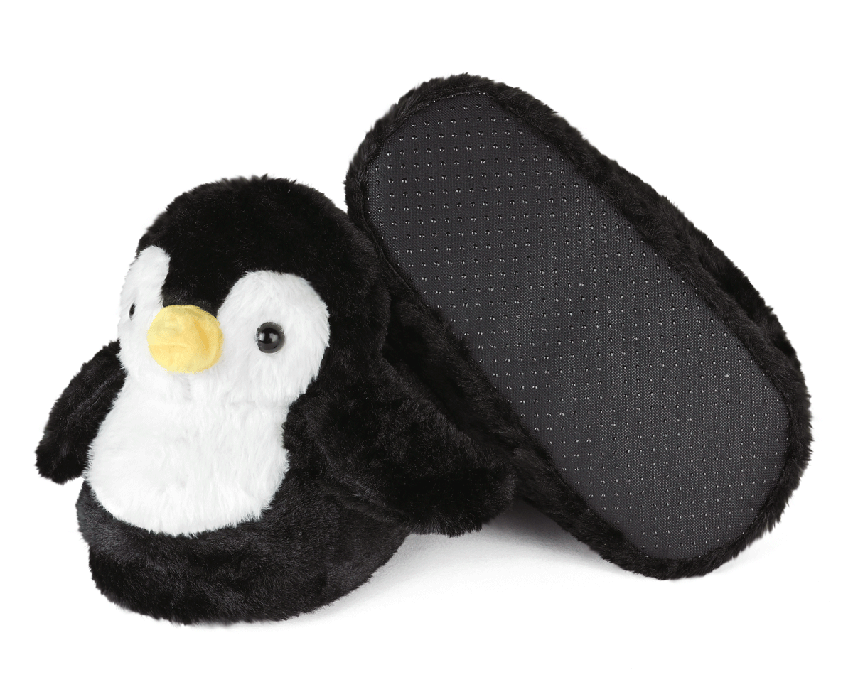 Pair of plush penguin slippers, one slipper is turned upside down to show non-slip grips