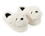 A pair of plush white slippers shaped like a dog or bulldog face, with black plastic eyes and nose and a small pink tongue, shown on a clean white background.