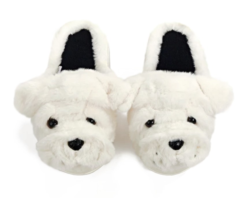 A pair of plush white dog-face slippers with black nose, eyes, and inner lining, photographed on a clean white background.