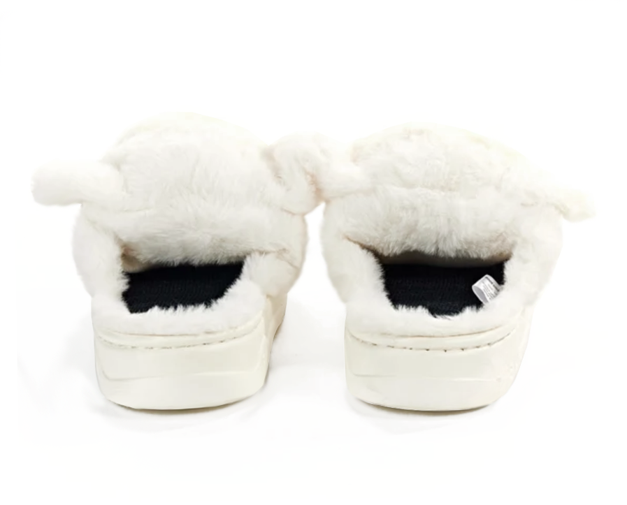 A pair of fluffy white slippers with long faux-fur trim and thick white soles, shown from the back on a white background.