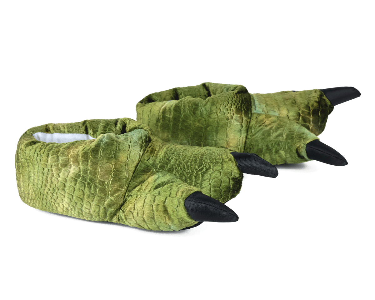 Pair of plush dinosaur claw slippers with green scaly textured plush and black claws, seen from the side.