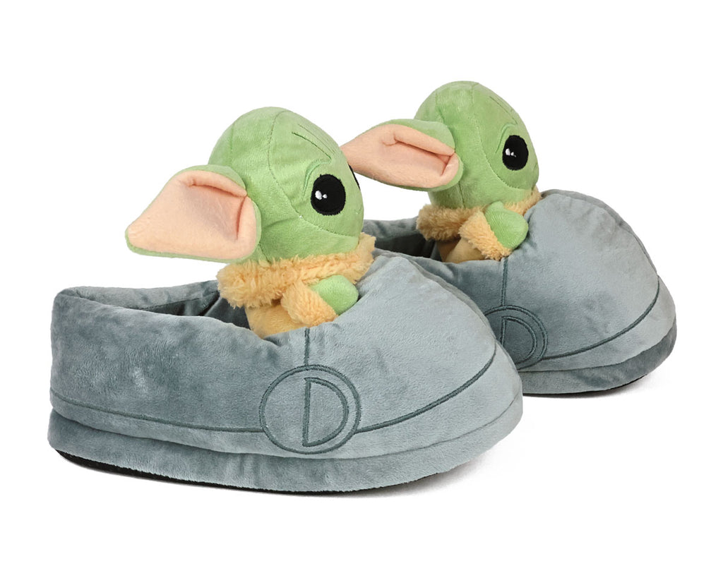 Side view of plush slippers shaped like the green Grogu character with big ears on a white background