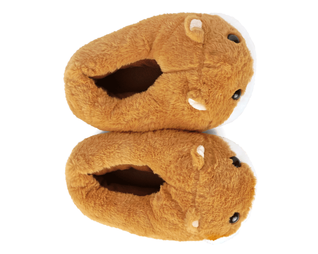 Pair of plush slippers shaped like guinea pigs, seen from above, on a white background