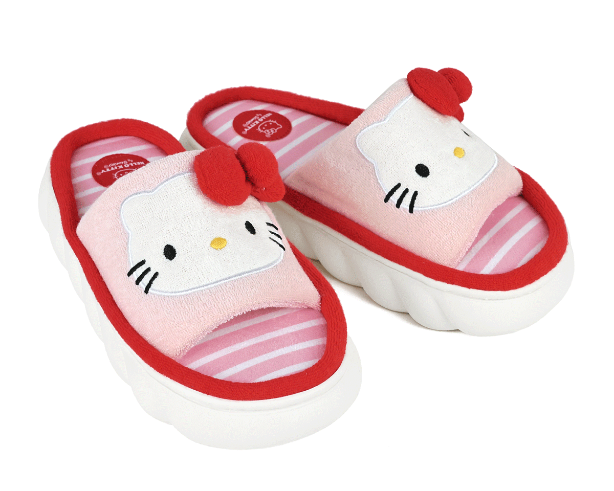 Hello Kitty slippers with red bows on a white background
