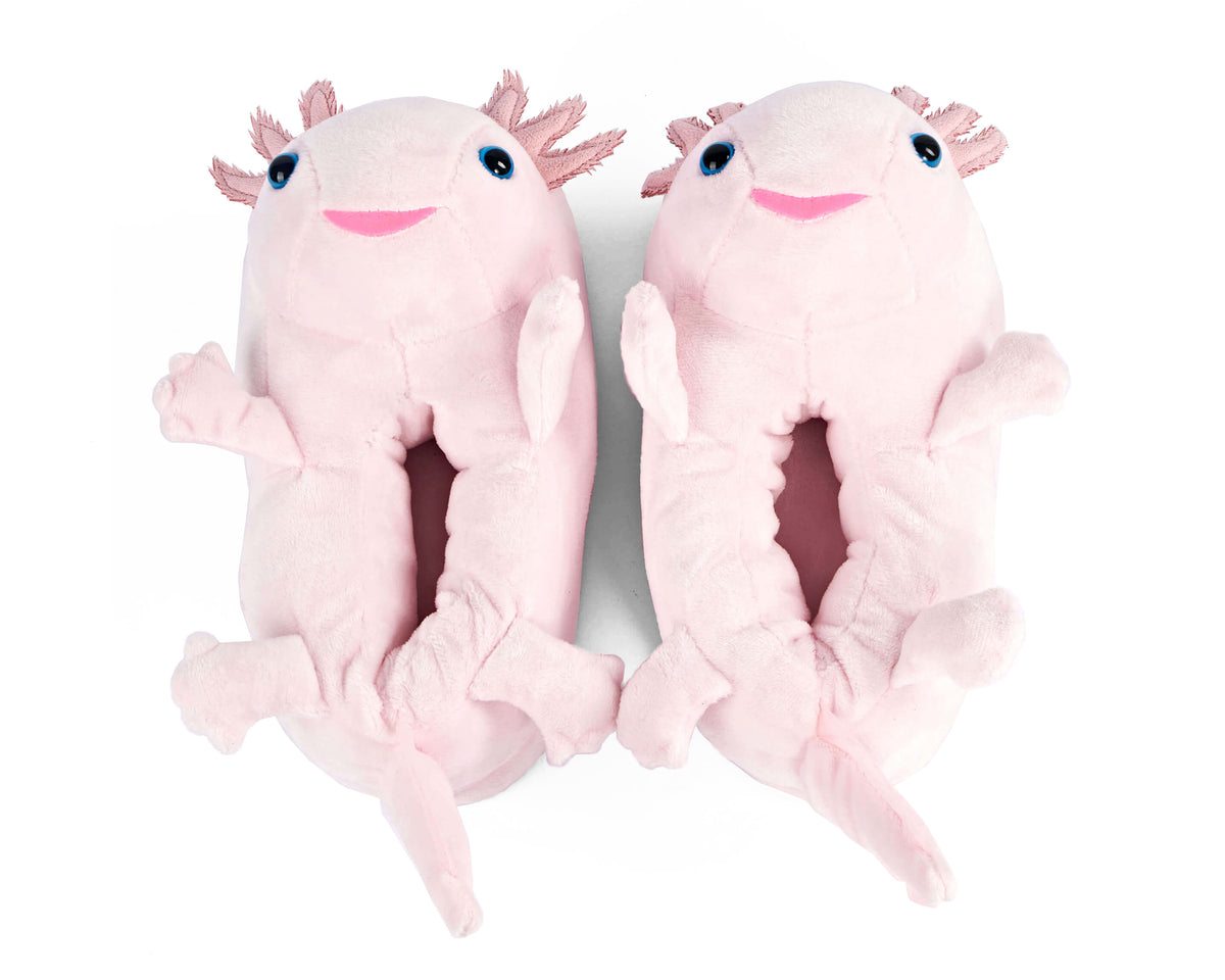 Pair of pink plush axolotl slippers seen from above on a white background
