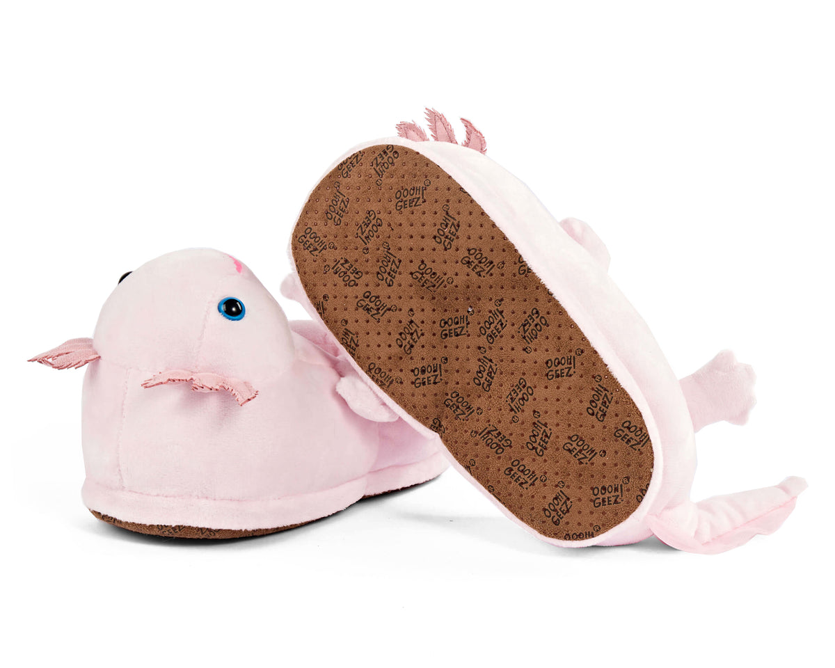 Pair of pink plush axolotl slippers with one slipper turned upside-down to show faux suede sole with non-slip grips