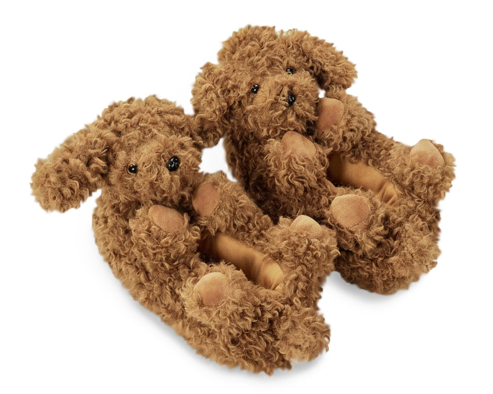 Pair of plush doodle dog slippers with curly textured brown fur, paws, ears, tails, and black eyes and noses