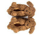 Pair of doodle dog slippers seen from above, showing curly brown plush, ears, paws, tails and black eyes and noses, on a white background