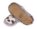 A pair of plush fuzzy slippers shaped like sloths, with one slipper showing the brown textured footbed and the other showing the gray faux-fur exterior and sloth face.