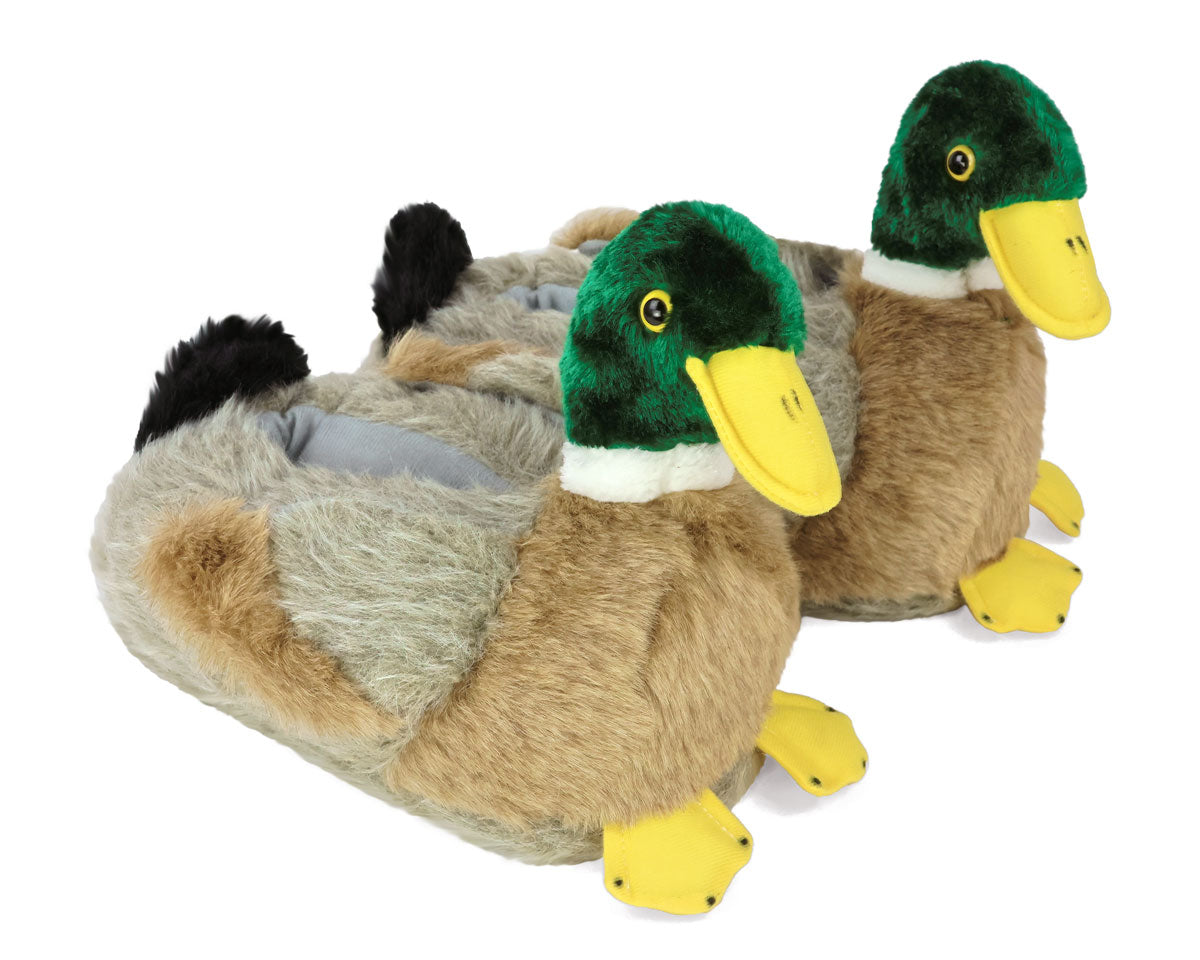 Plush duck-shaped slippers on a white background