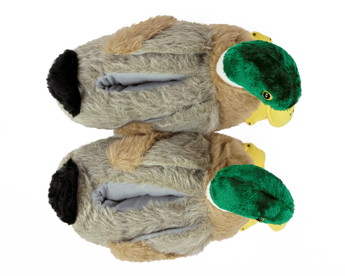 Plush duck slippers seen from above on a white background