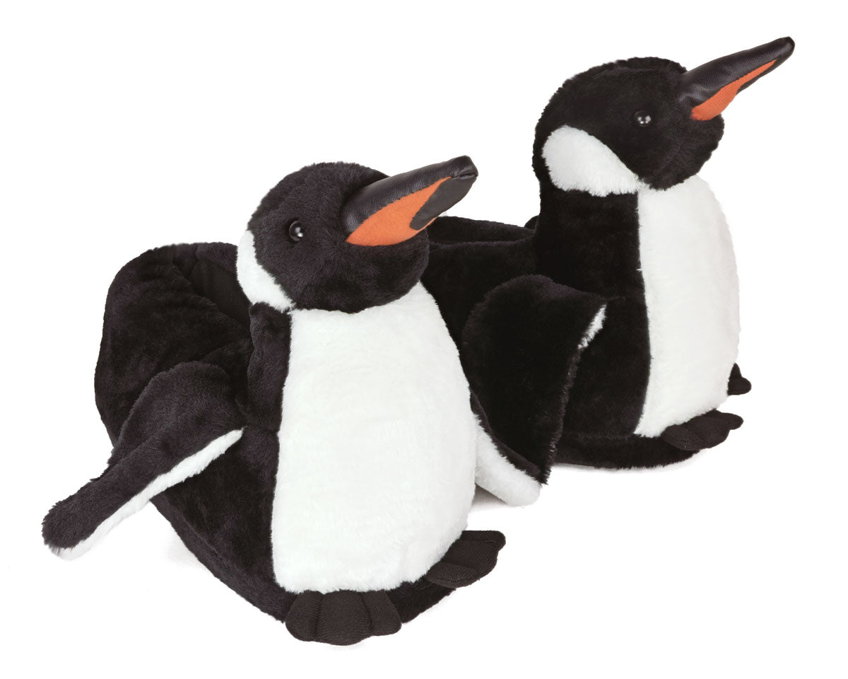 Two plush penguins slippers on a white background