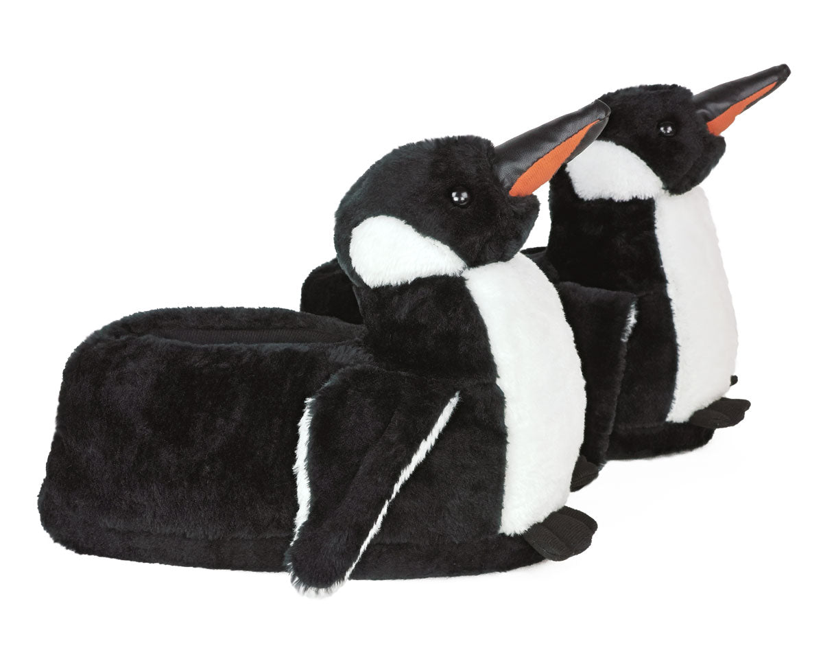 Plush penguin slippers on a white background