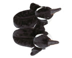 Two plush penguins slippers seen from above against a white background