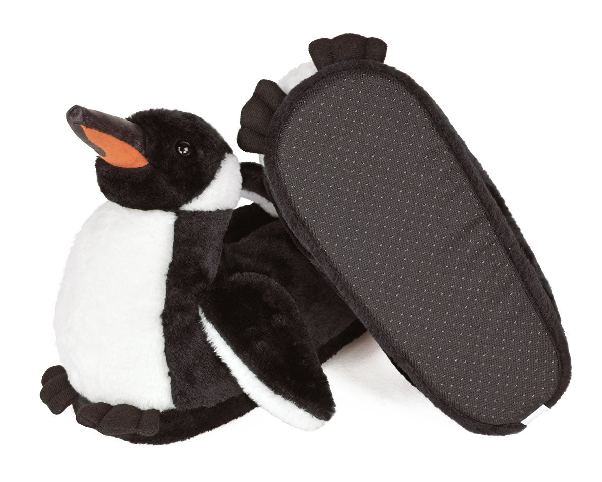 Pair of plush penguin slippers with one shown from below to see the textured sole