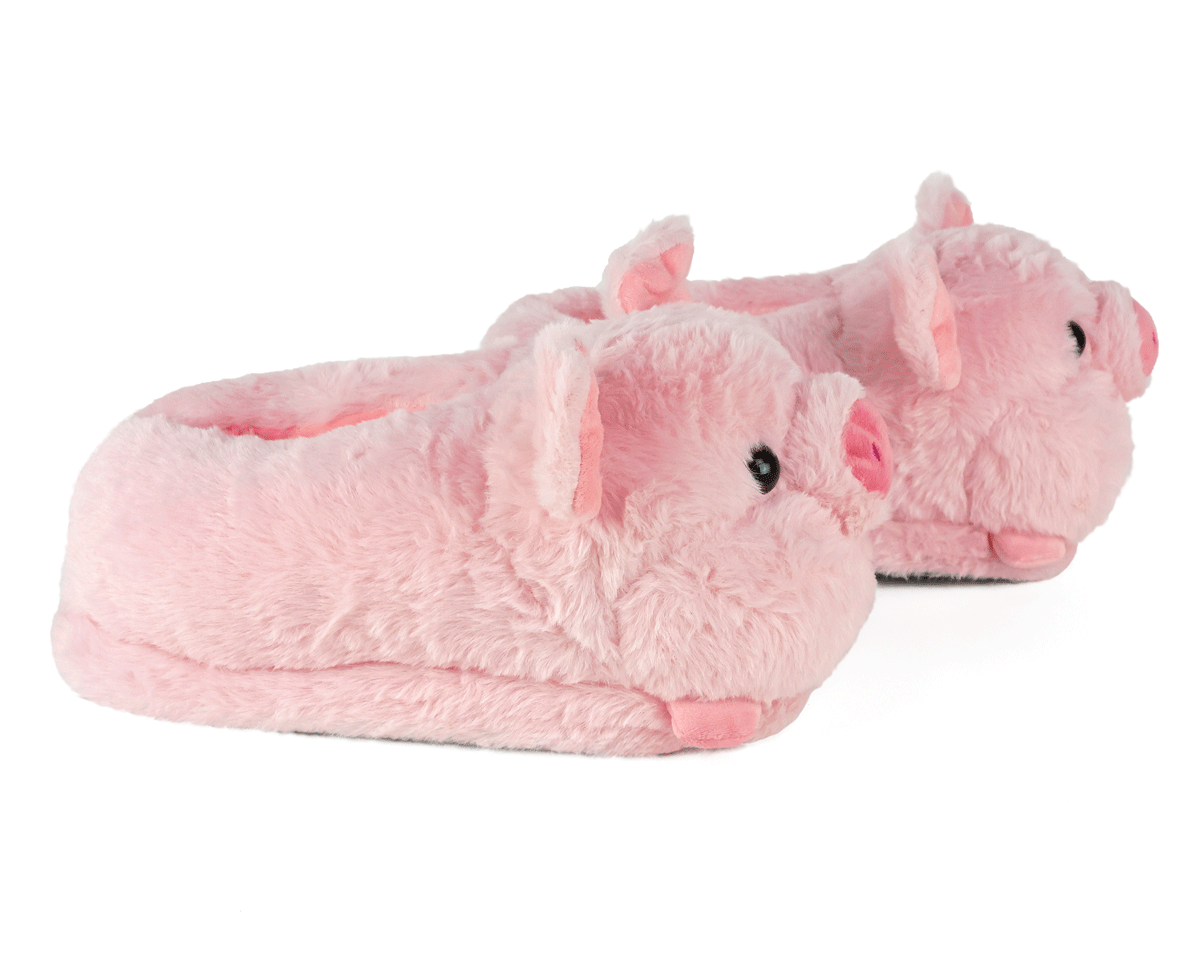 Pink pig-shaped slippers on a white background