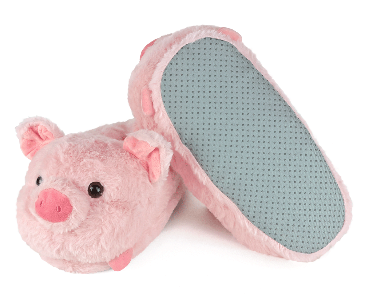 Pair of pink plush pig slippers, one is turned upside down to show a gray fabric sole with non-slip grips